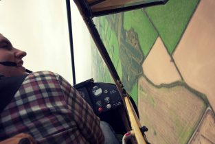 Brian O'Keeffe and Neil Sheehan doing some wingovers in Howard Cox's Piper Cub G-BJEI. Photo by Neil Sheehan.