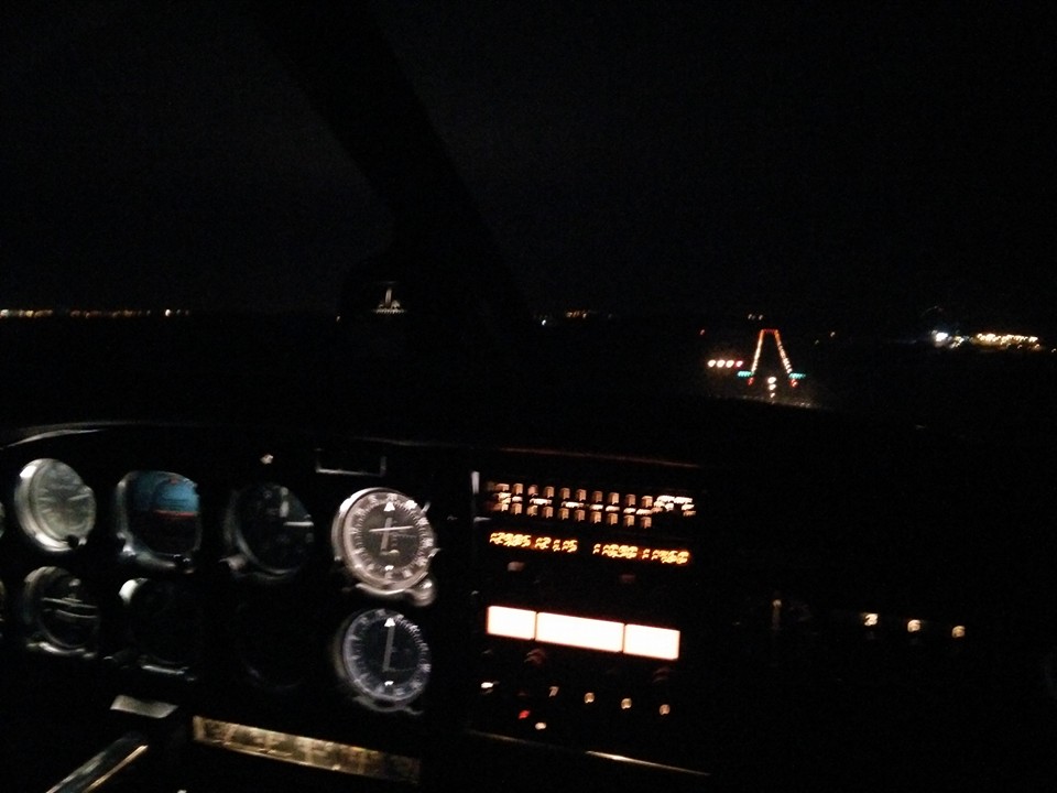 EI-DJM on final approach at night